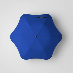Blue umbrella on a white background
