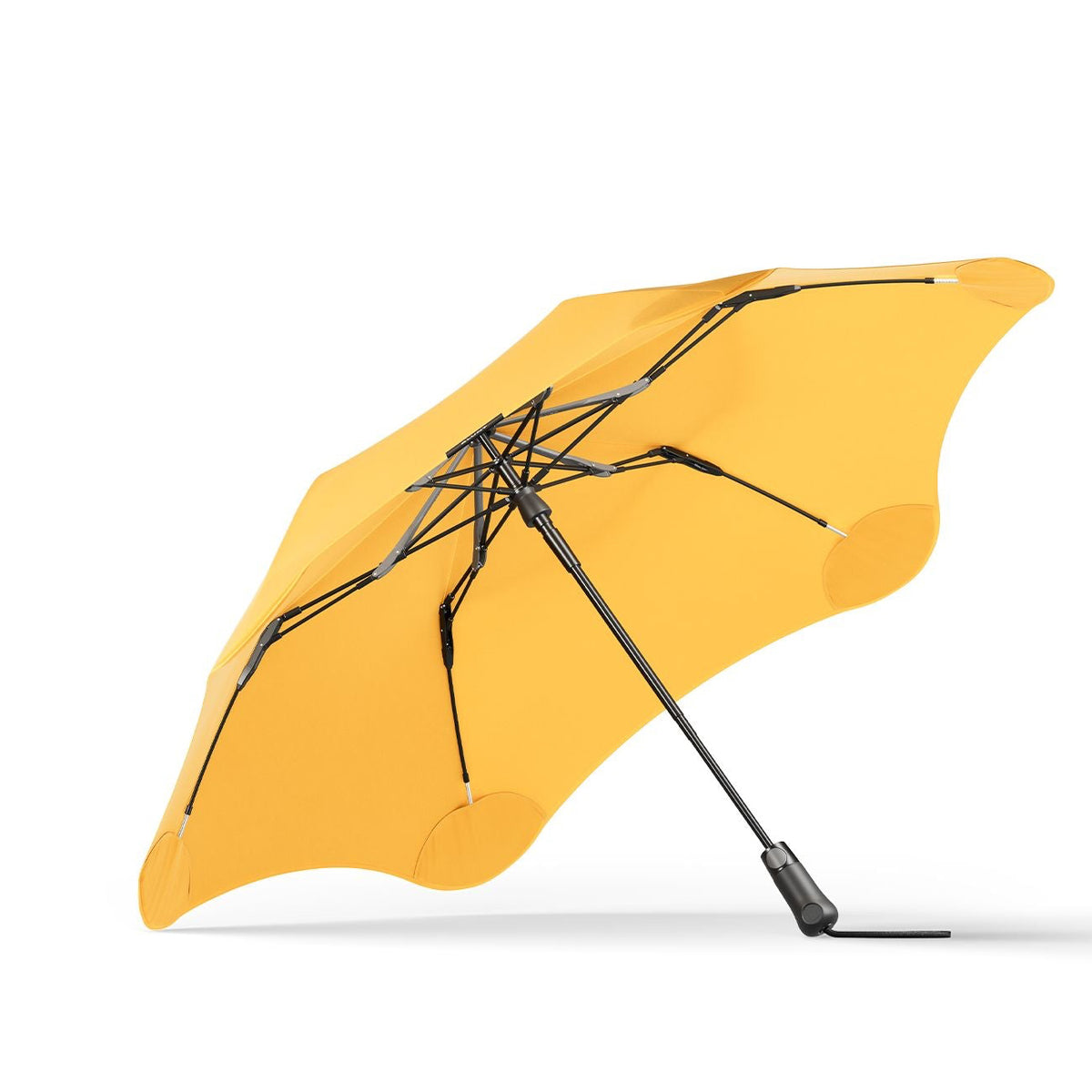 Yellow umbrella with black ribs on a white background