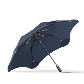 Navy blue umbrella on a white background