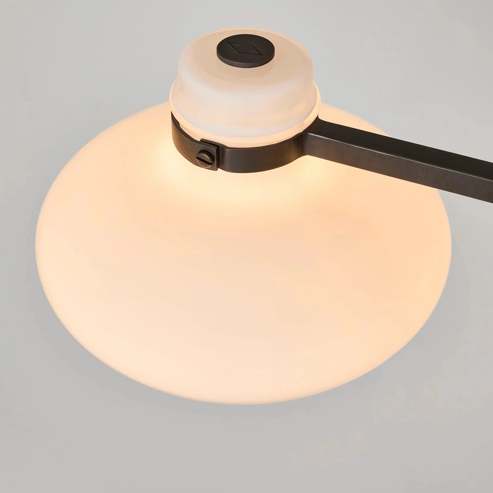 Modern ceiling light fixture on a gray background