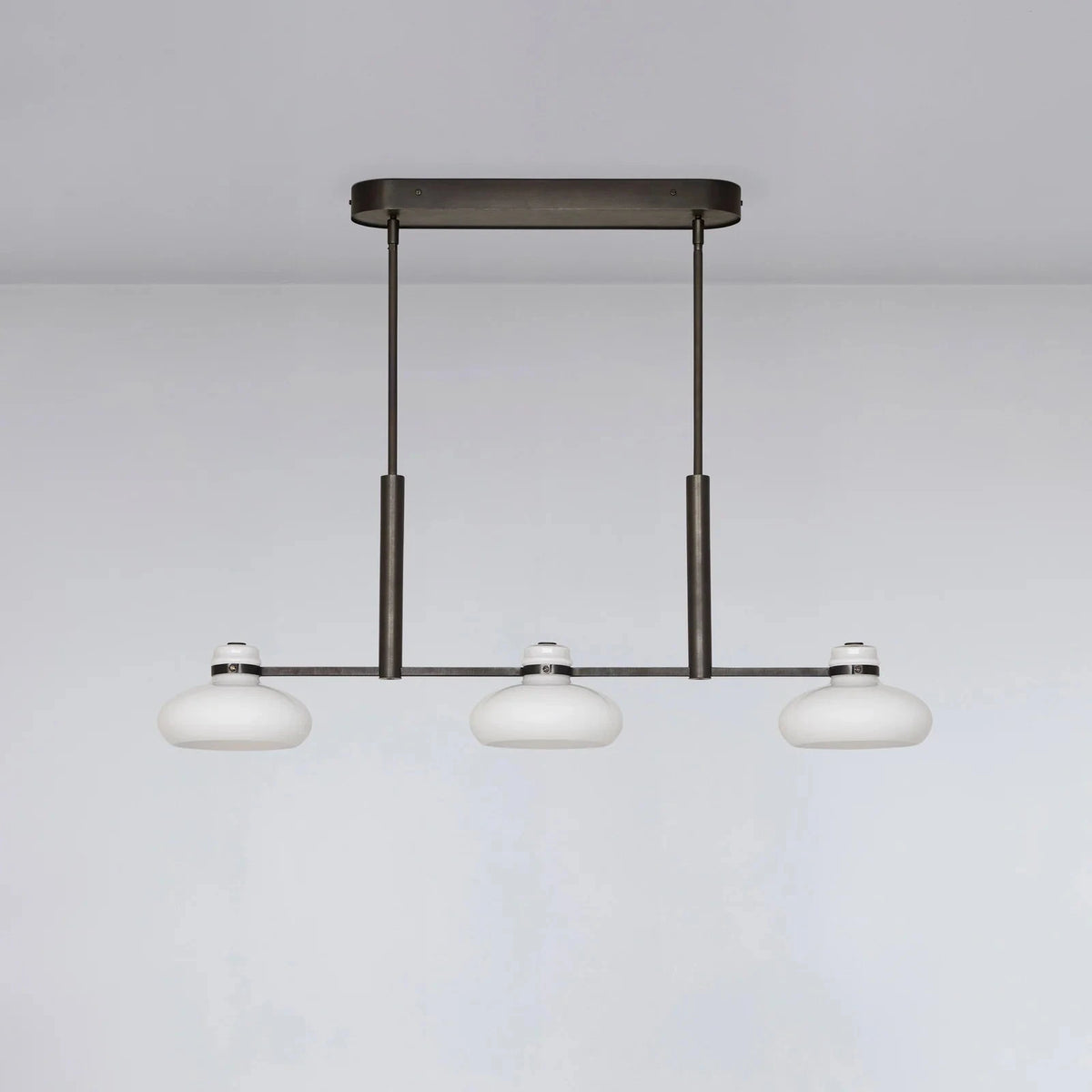 Modern pendant light fixture on a plain background