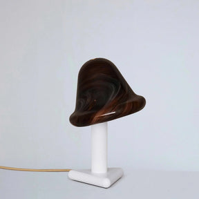 Wooden lamp with a white base on a light gray background