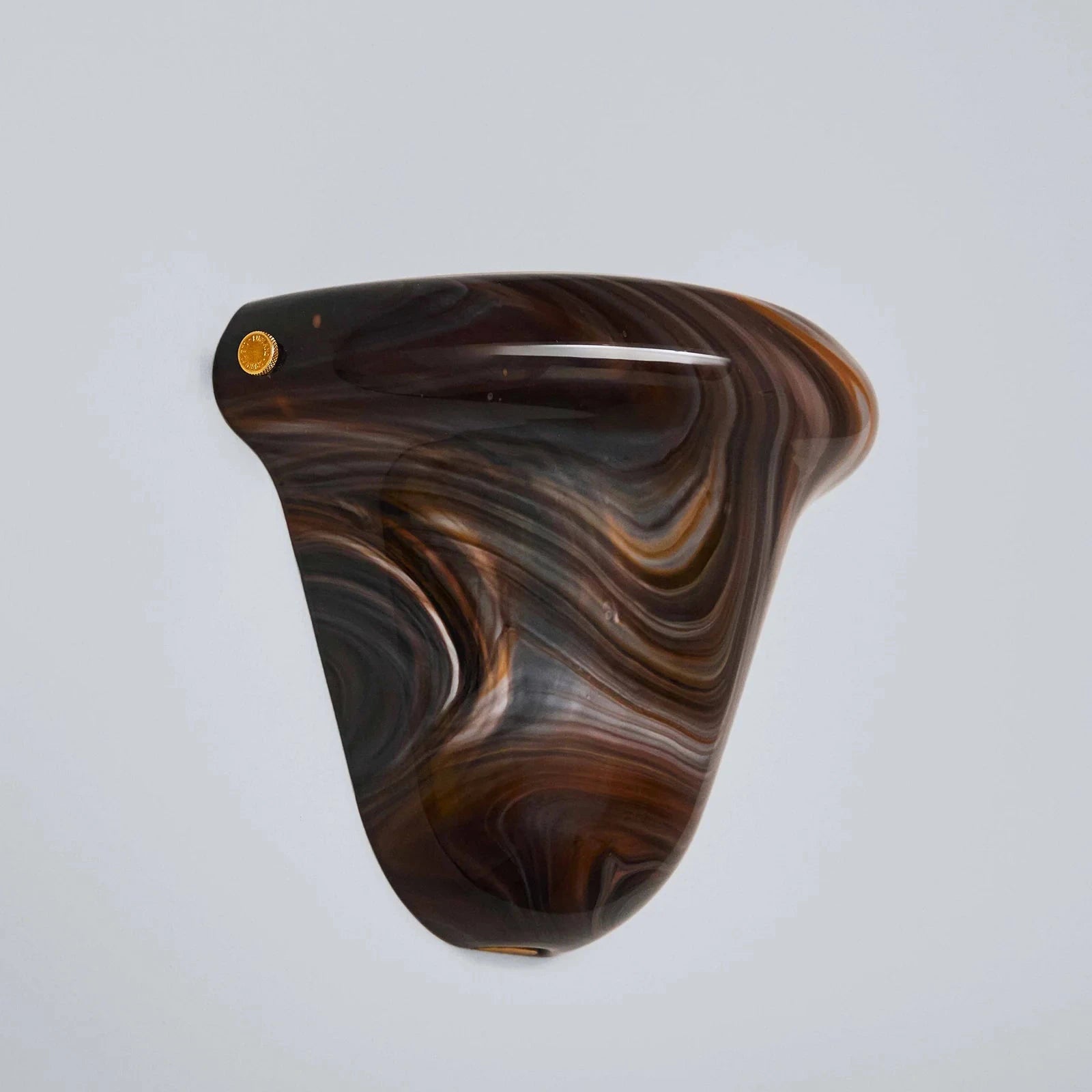Wooden product with swirling pattern on a light gray background