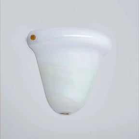 A vintage-style white glass wall sconce with a flared, bell-shaped shade and a small gold screw detail on the left side, shown against a plain light gray background.