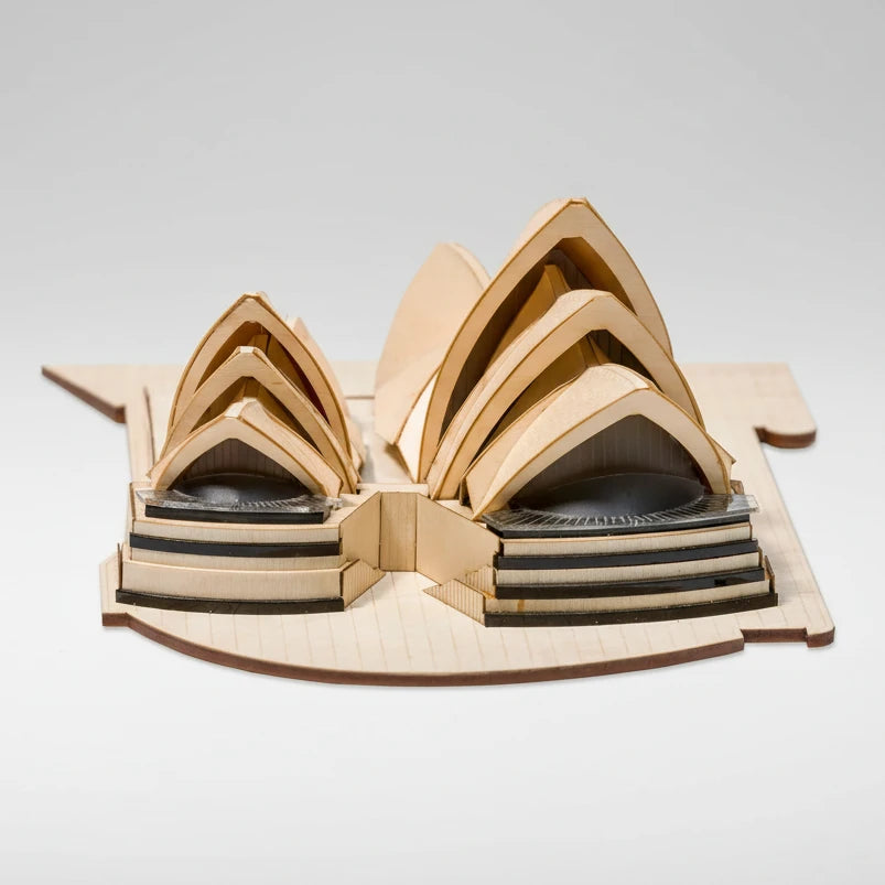 Wooden model of the Sydney Opera House on a white background