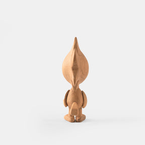 Wooden figurine of an animated cartoon character carved from light oak, featuring a tall stylized head shape, simplified body and limbs, subtle tail detail, visible natural wood grain, and a smooth matte surface on a plain white background.