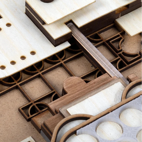 Wooden puzzle pieces on a cardboard base