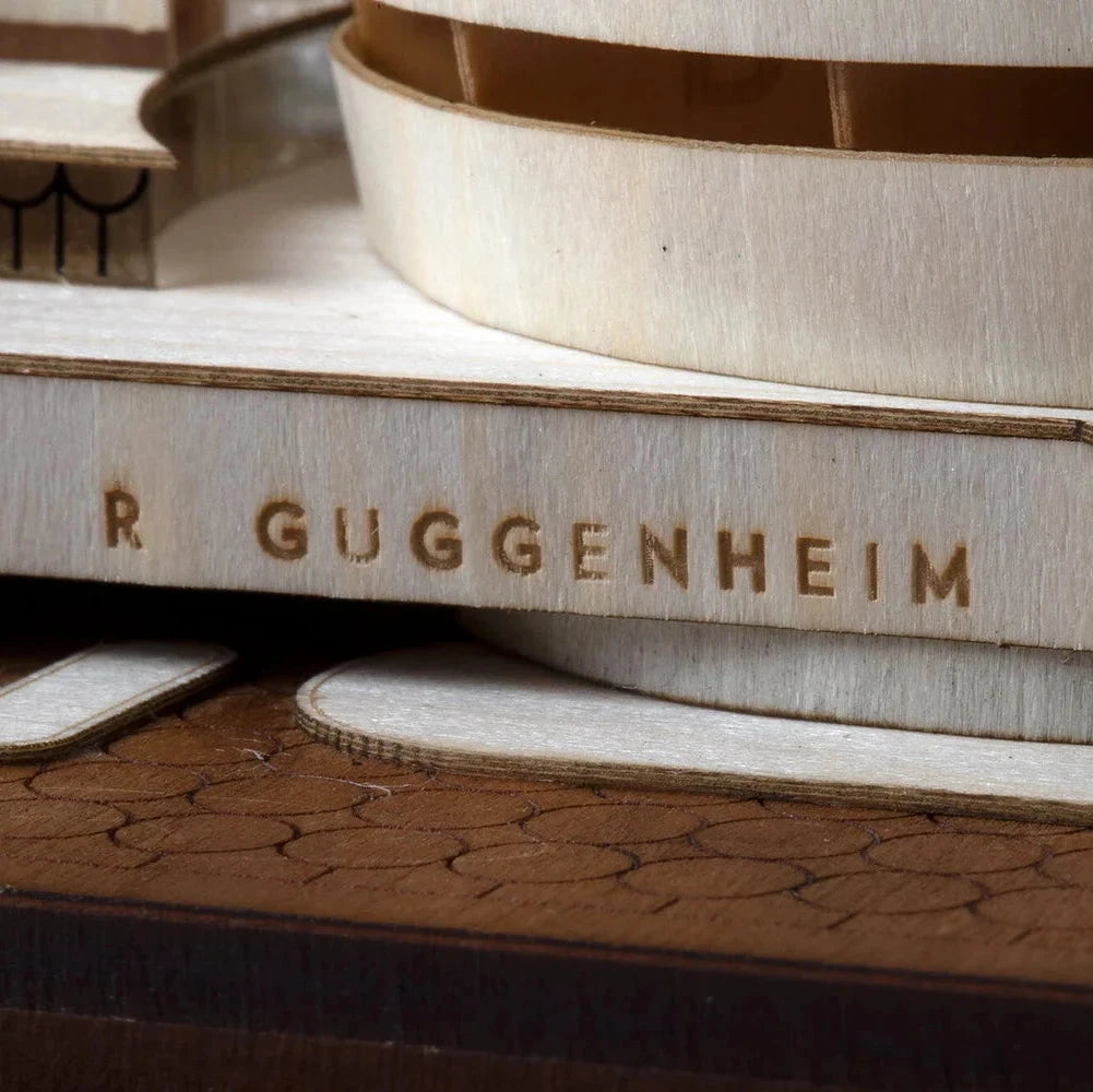 Stack of books with 'R. Guggenheim Museum' embossed on the spine.
