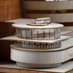 Wooden model of a circular architectural structure with 'The Sol' branding.