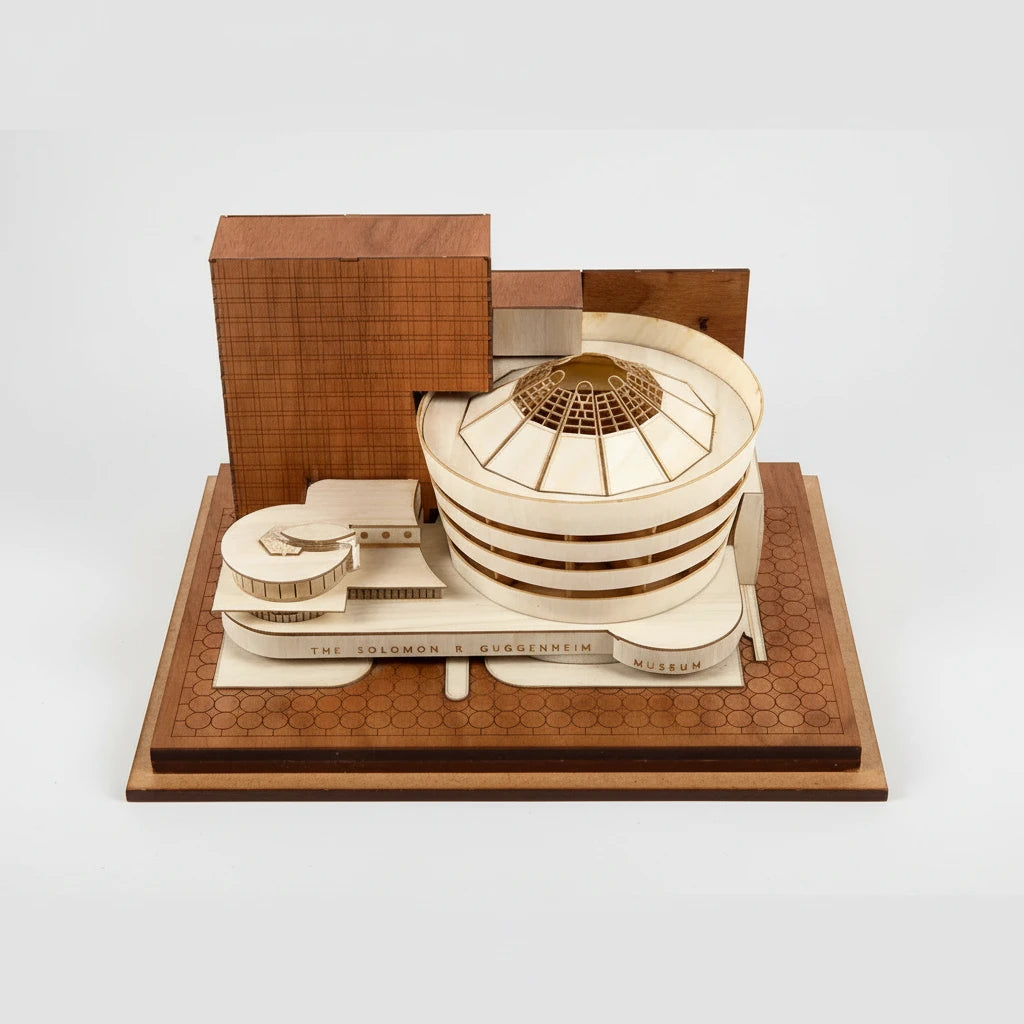 Wooden model of a building with a wooden box on a white background