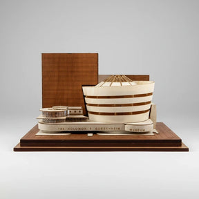 Model of The Solomon R. Guggenheim Museum on a wooden base with a gray background