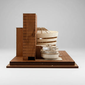 Wooden architectural model of a building on a white background