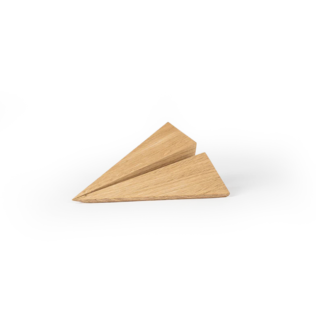 Angular wooden object crafted from light oak, featuring sharp folded planes, clean geometric lines, visible natural wood grain, and a smooth matte surface on a plain white background.