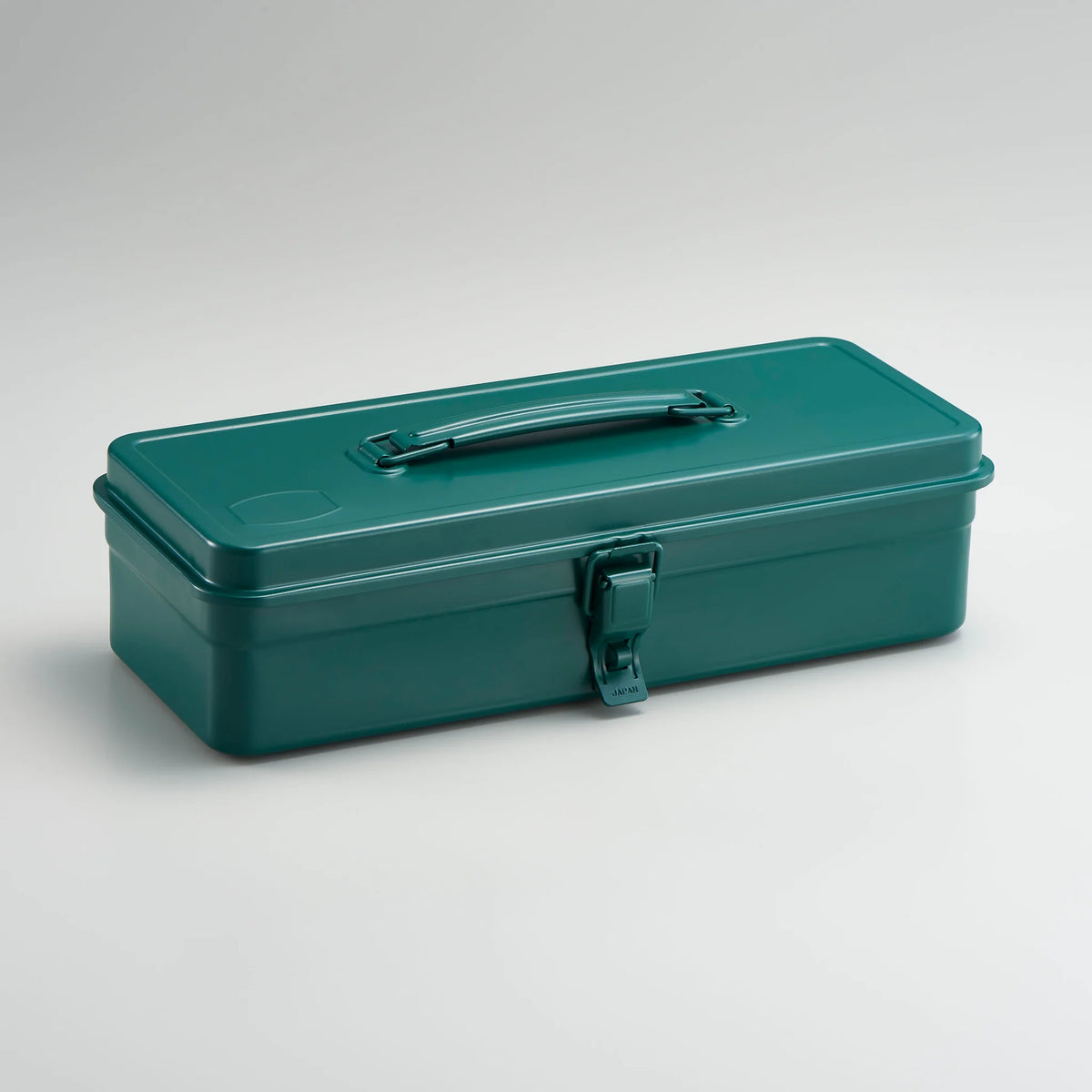 Antique green Toyo Steel metal toolbox with smooth rectangular design, top carry handle, and single front latch, photographed closed against a neutral light gray background.