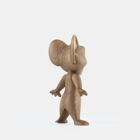 Wooden mouse figurine on a white background