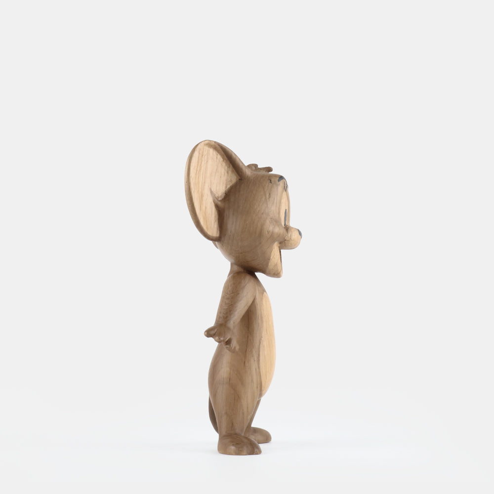 Wooden mouse figurine on a white background