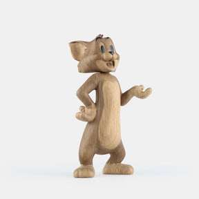 Wooden figurine of an animated cartoon mouse character, carved from light-toned wood, featuring expressive facial details, rounded ears, a standing pose with one hand raised, visible wood grain, and a smooth matte surface on a plain white background.