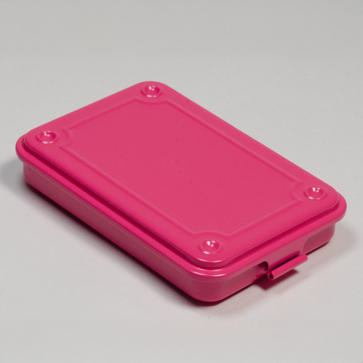 pink steel stackable storage box with fitted lid and front latch, shown closed.