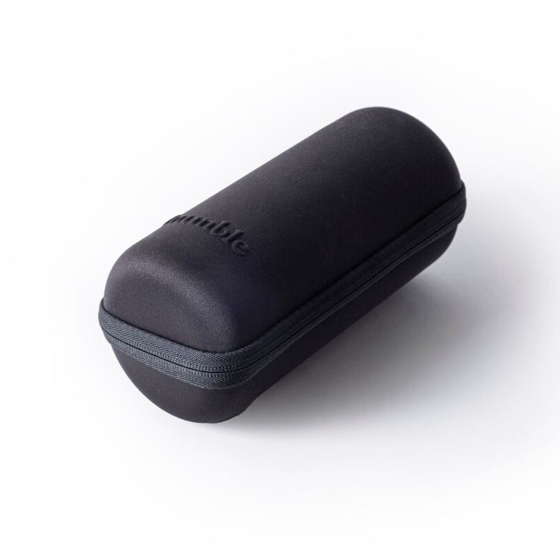 A black travel case with a zipper, possibly made of hard plastic or metal, with the brand name visible on the top