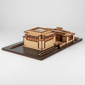 Wooden model of a modern architectural design on a white background