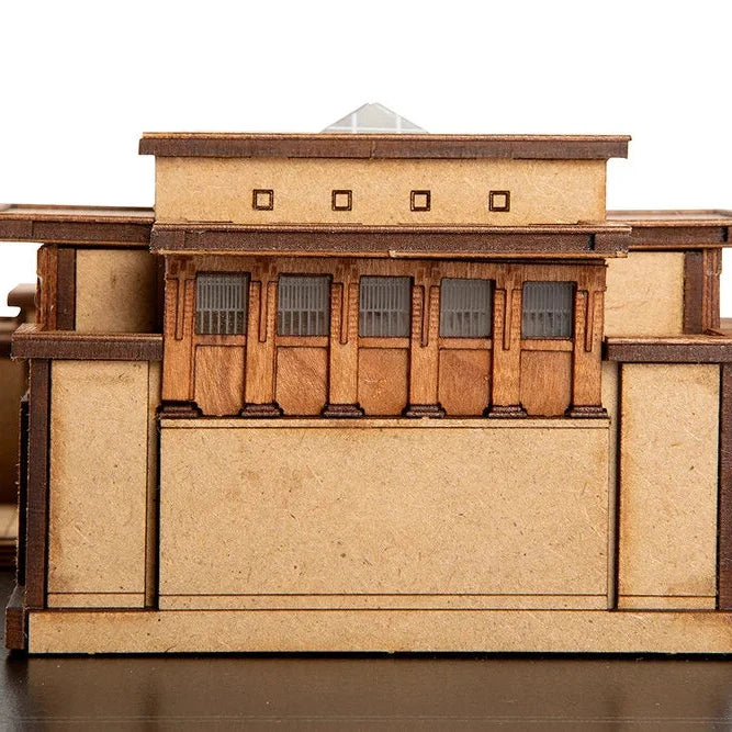 Wooden model of a building with a white background