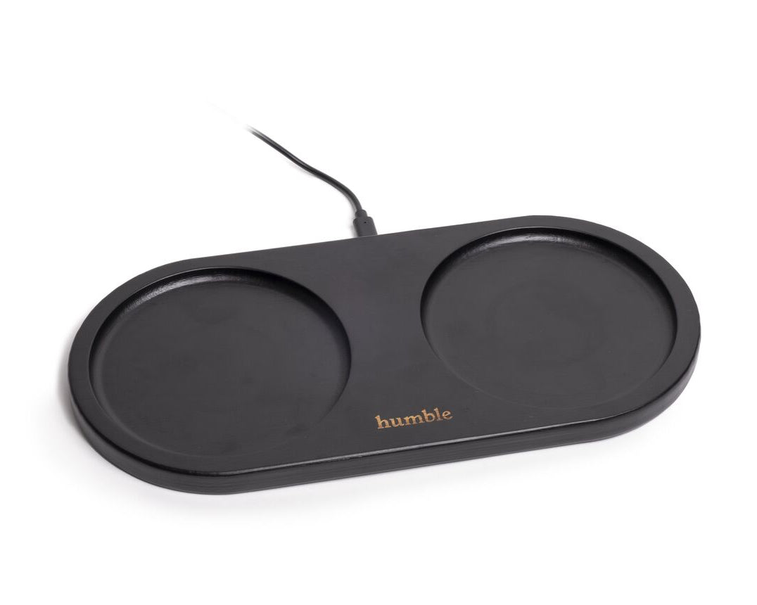 A black wireless charger with two circular charging pads, branded 'humble'.