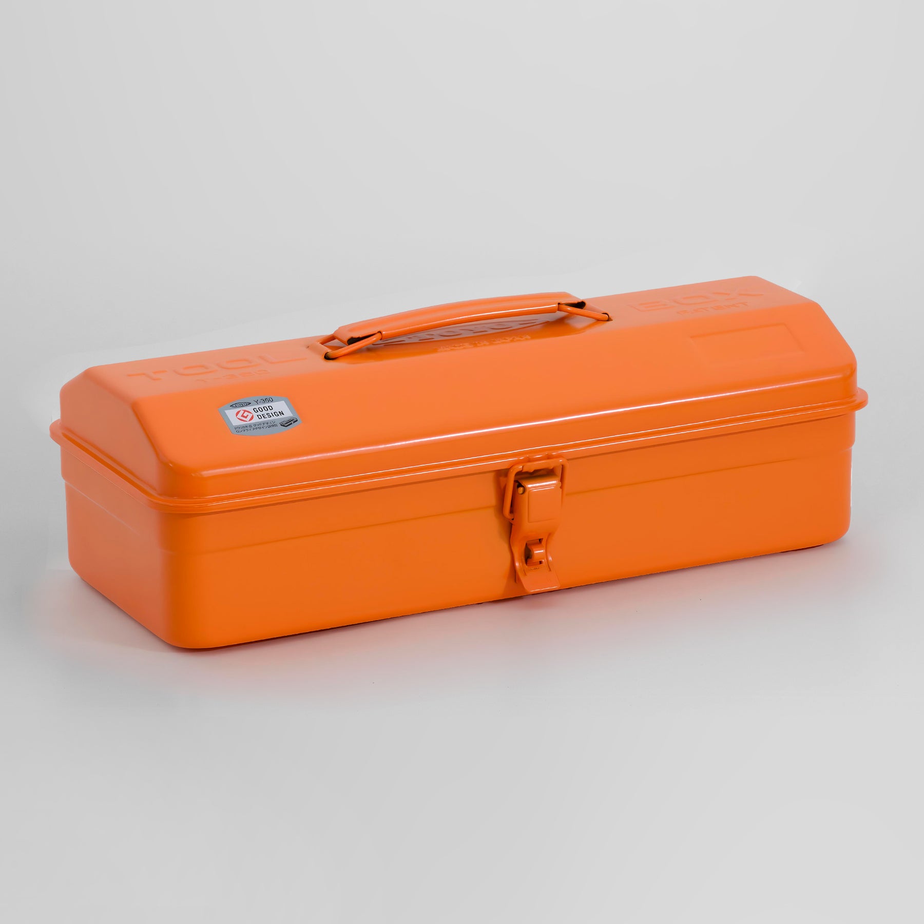 Toyo Y-350 steel toolbox in bright orange with top carry handle and single front latch, shown closed on a light gray background.