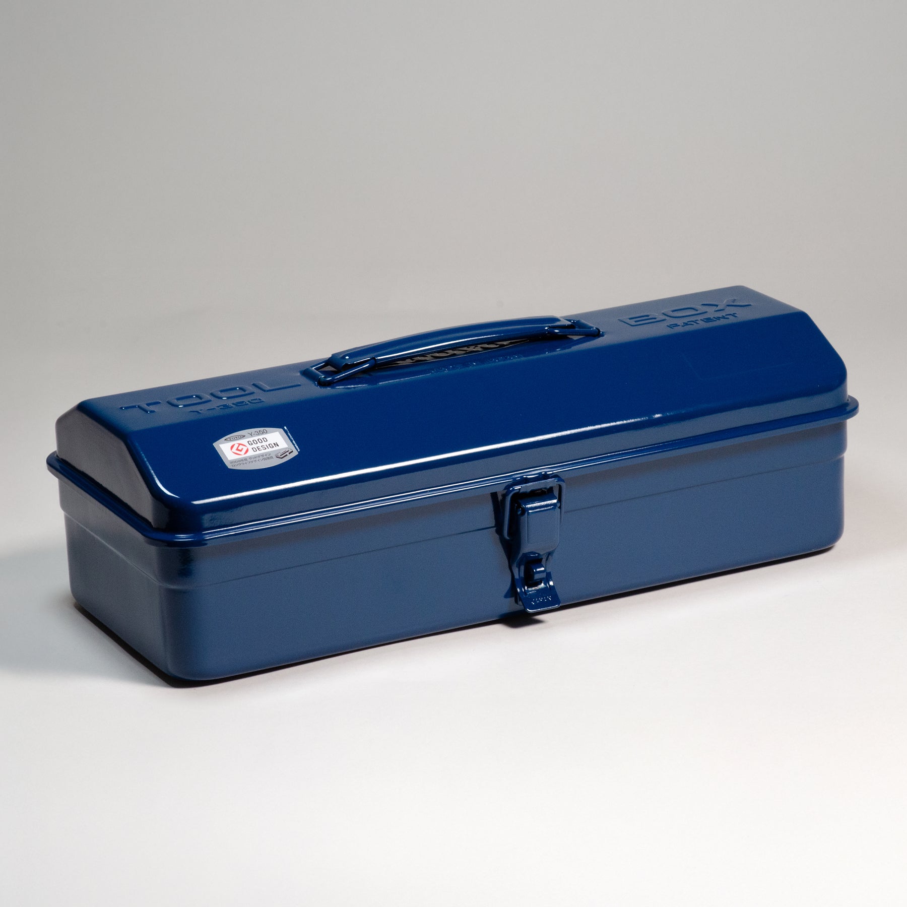 Indigo blue Toyo Y-350 steel toolbox with glossy finish, rounded lid, top carry handle, and single front latch, shown closed on a light gray studio background.