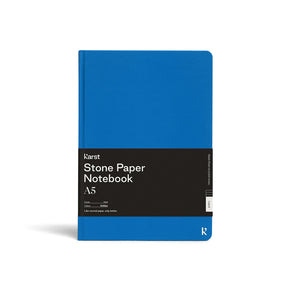 Blue notebook with black label on a white background
