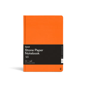 Orange notebook with black label on a white background