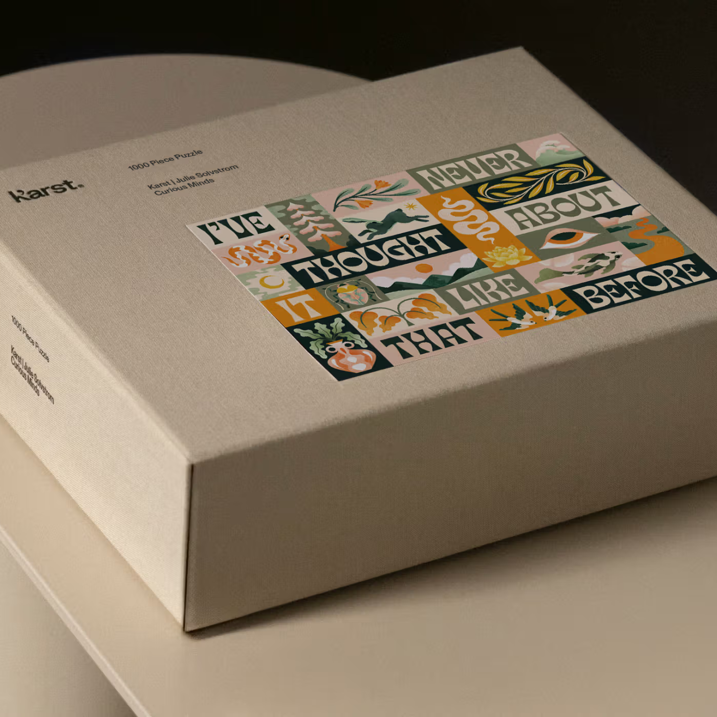 Beige box with colorful text design on a dark background