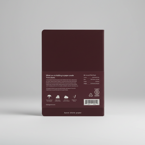 Back view of a maroon notebook with text and a barcode on a white background