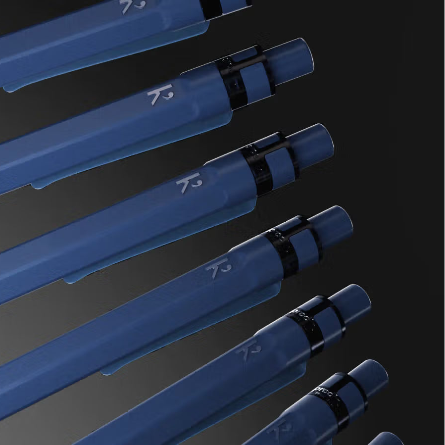 Blue pens with visible branding on a dark background