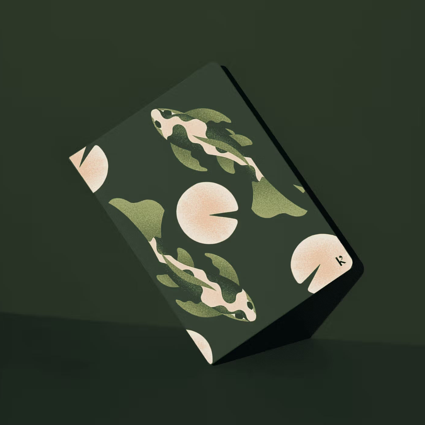 Notebook with nature-themed design on a dark green background