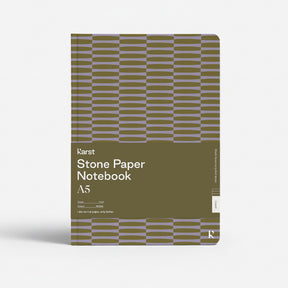 Green notebook with geometric pattern on a white background