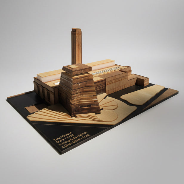 Wooden model of a building on a white background