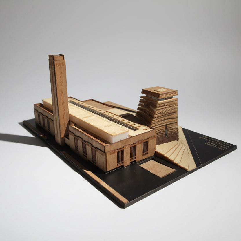 Wooden model of a building on a black base with a white background