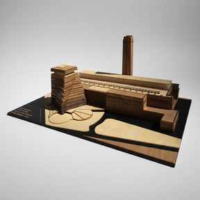 Model of a factory layout on a black base with a white background