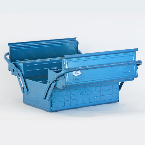 Blue metal toolbox with a raised handle and textured square-pattern exterior, photographed on a white background.