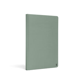 Karst A5 stone paper notebook with a sage green hard cover, shown at a three-quarter angle on a white background, featuring a clean minimalist design with a subtle embossed Karst logo in the lower corner.