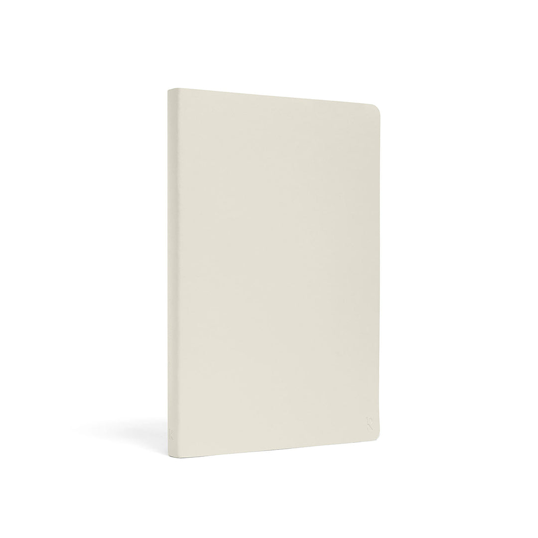 Karst Stone Paper Notebook A5 with a minimalist stone-colored soft cover, shown at a slight angled view on a white background.