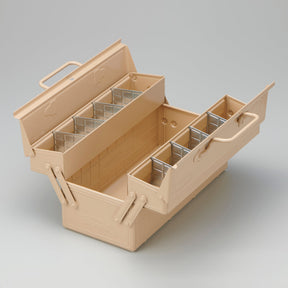 Toyo ST-350 steel cantilever toolbox in beige, open with tiered trays extended, showing removable metal dividers and a central storage compartment on a neutral background.