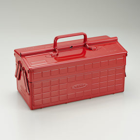 Red Toyo steel cantilever toolbox, closed, three-quarter front view with raised carry handle.