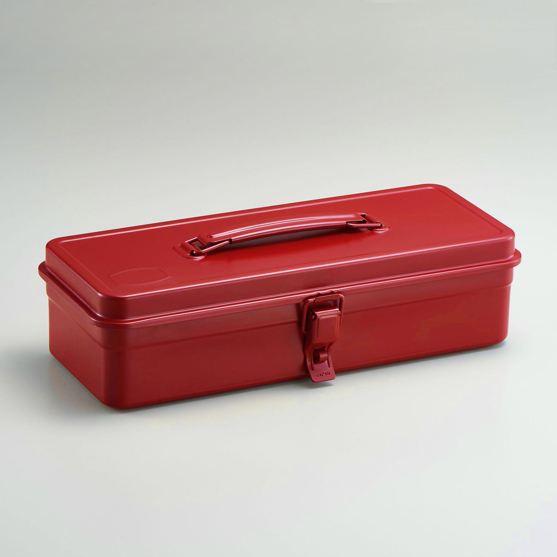Closed red Toyo Steel metal toolbox with single latch and top handle, shown on a clean white background