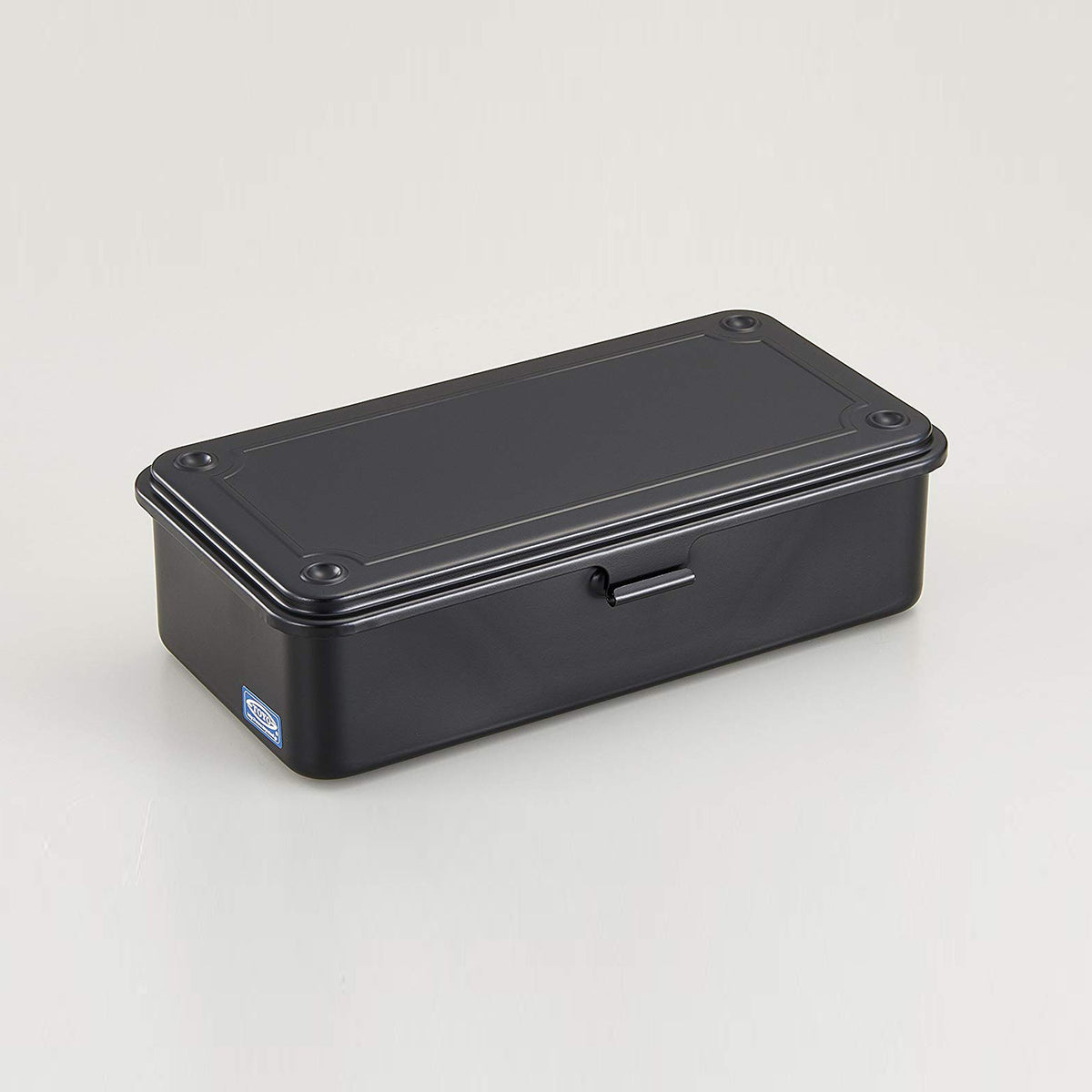 Black Toyo Steel T-190 compact metal storage box with rounded corners and a front pull tab, shown closed on a light neutral background.
