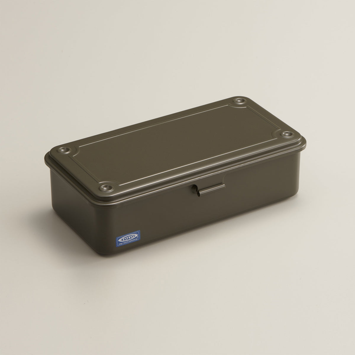 military green Toyo Steel T-190 compact metal storage box with rounded corners and a front pull tab, shown closed on a neutral light background.