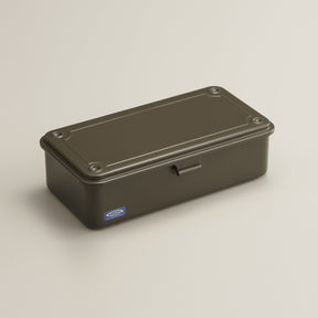 military green Toyo Steel T-190 compact metal storage box with rounded corners and a front pull tab, shown closed on a neutral light background.