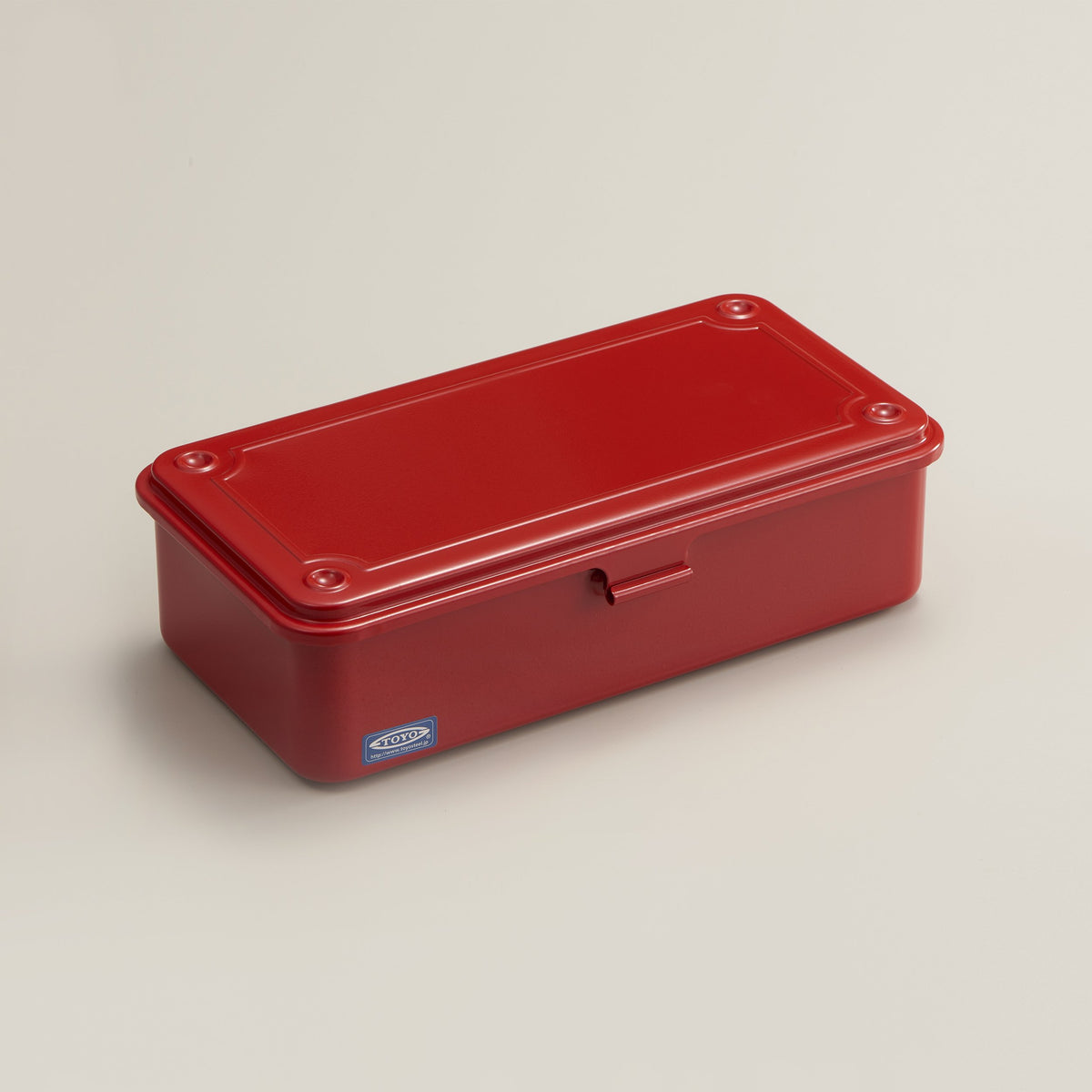 Red Toyo Steel T-190 metal storage box with hinged lid and front latch, shown closed on a neutral background.