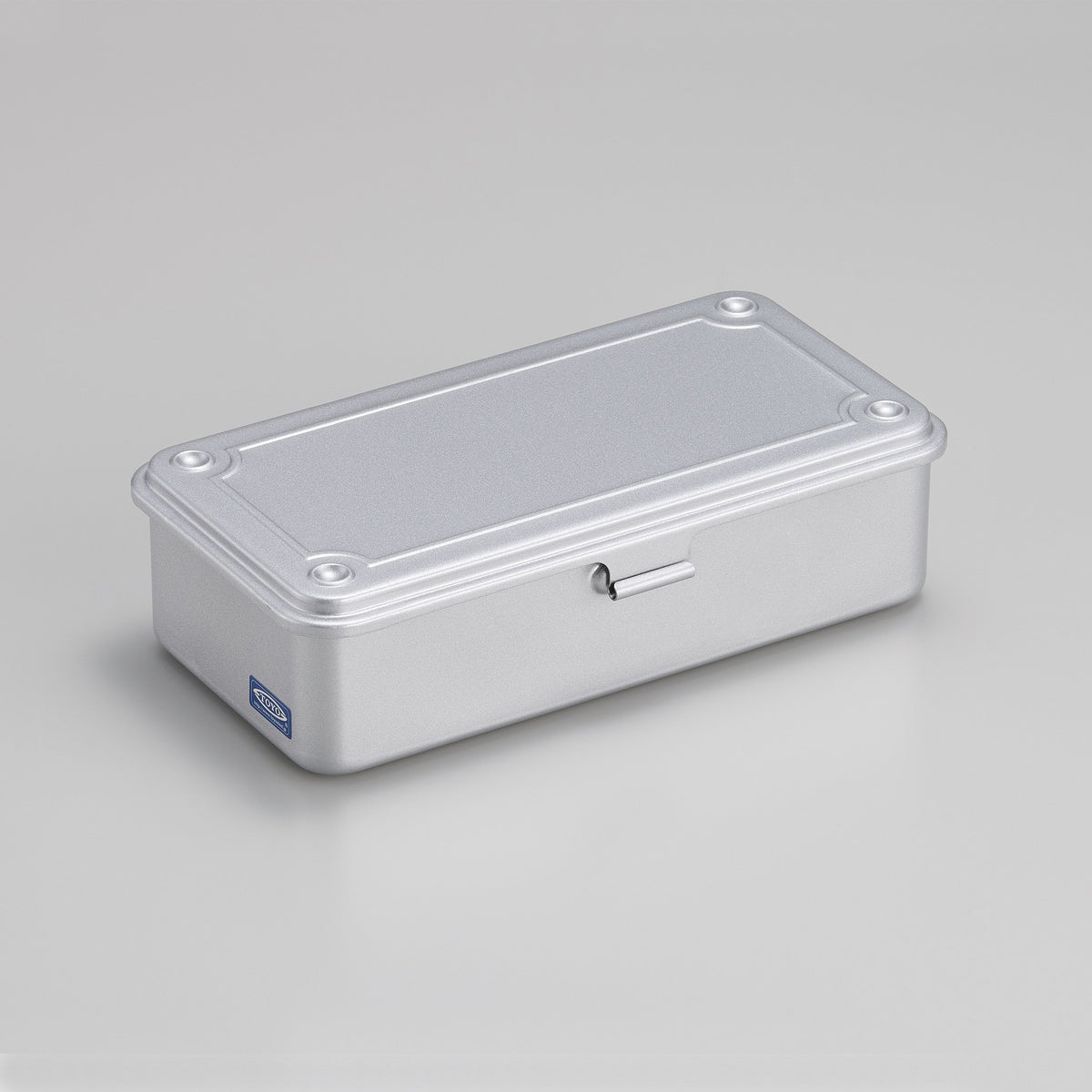 Silver Toyo Steel T-190 compact metal storage box with rounded corners and front pull tab, shown closed on a light gray background.