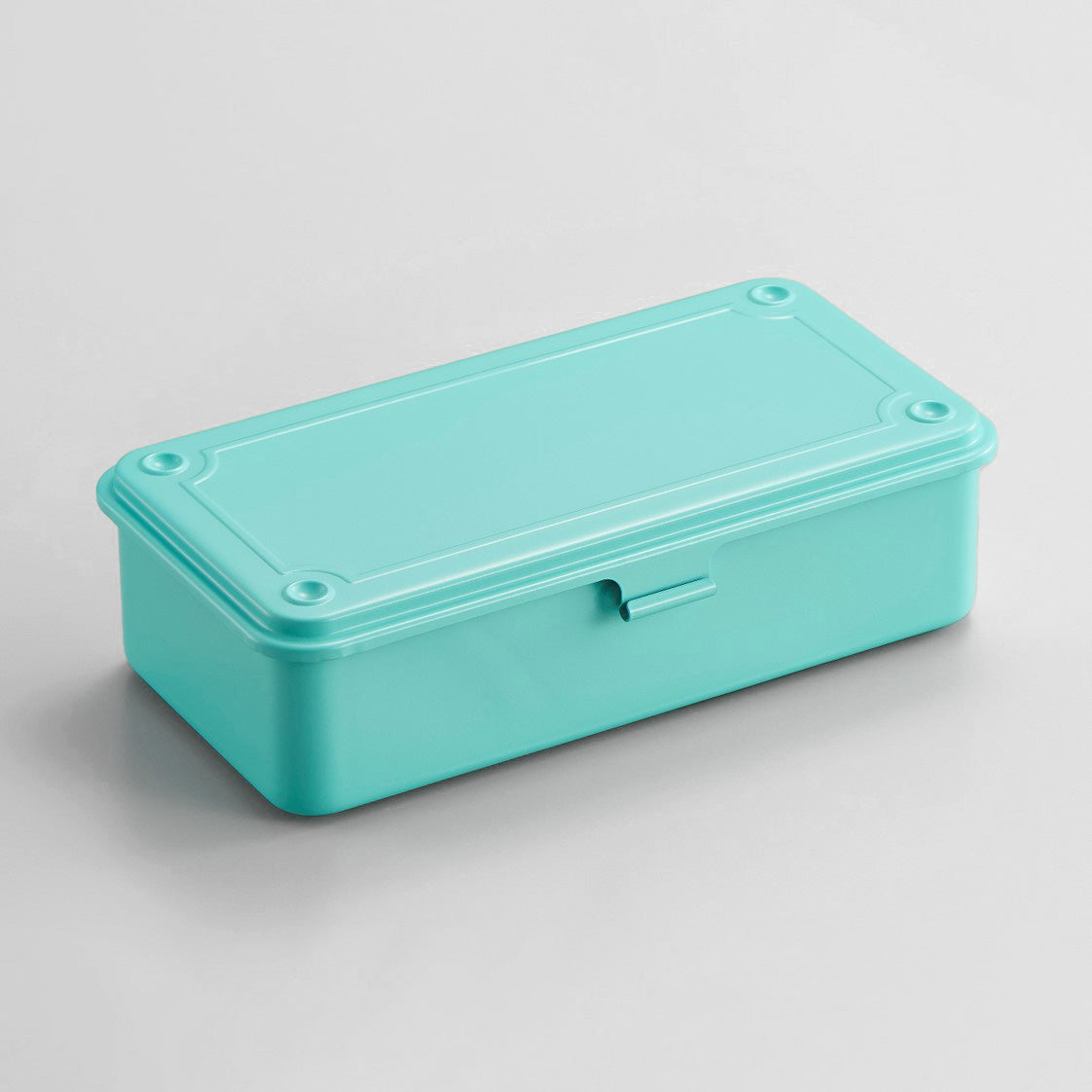 Summer emerald Toyo Steel T-190 compact metal storage box with rounded corners and front pull tab, shown closed on a light gray background.
